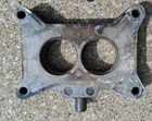1964 Ford/mustang 289 V-8 Barrel Carburetor Spacer Plate Used. Price: $40.00.